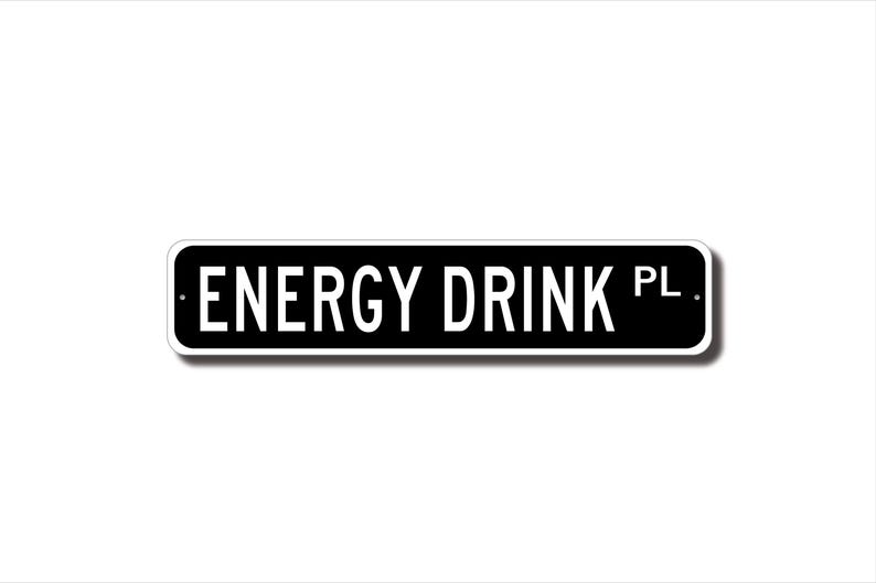 A black and white rectangular sign with the text "ENERGY DRINK PL" printed on it.