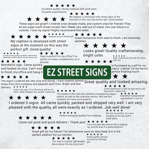 a green street sign sitting on top of a piece of paper