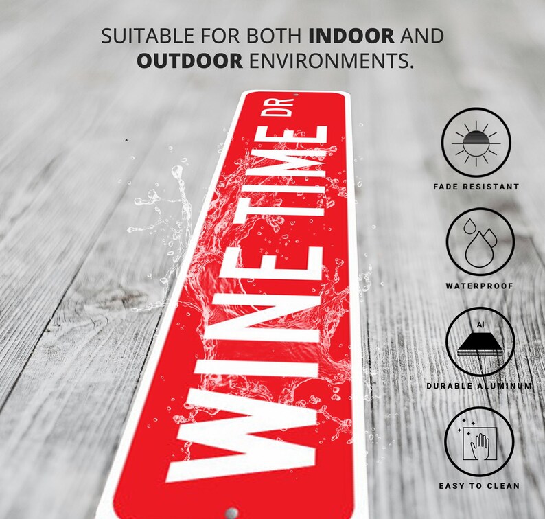 a red and white sign sitting on top of a wooden floor