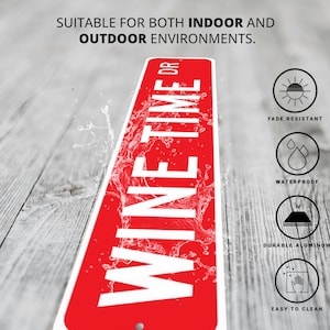 a red and white sign sitting on top of a wooden floor