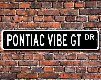 May include: Black and white street sign with the text "PONTIAC VIBE GT DR."