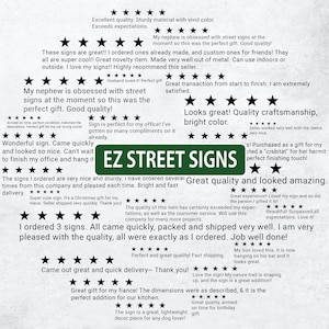 a green street sign sitting on top of a piece of paper