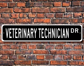 May include: Black and white street sign with the text "Veterinary Technician Dr." on a brick wall background.