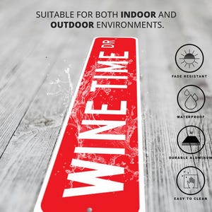 a red and white sign sitting on top of a wooden floor