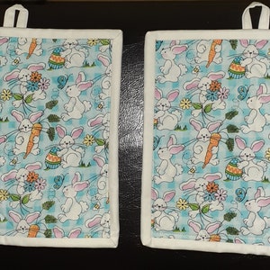 Custom designed potholders sold in pairs
