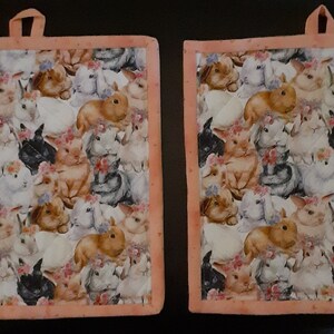 Custom designed potholders sold in pairs