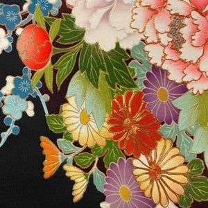 May include: A black fabric featuring a vibrant floral pattern with large pink peonies, white blossoms, and various chrysanthemums in shades of red, yellow, and purple. The design includes green leaves and small blue flowers, all outlined with fine gold metallic thread.