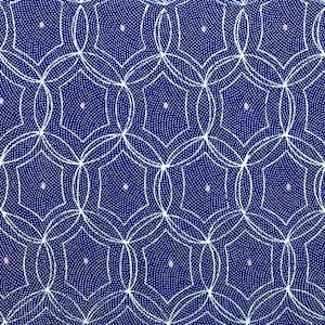 May include: A blue fabric with a white geometric pattern of overlapping circles and stars. The fabric has a subtle texture.