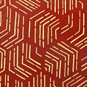 May include: A red background with a geometric pattern of thin, yellow lines forming a repeating hexagonal design.