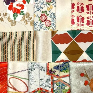 May include: A collection of twelve fabric swatches featuring diverse patterns including red and white peonies, geometric diamond shapes in green and brown, intricate floral motifs, thin vertical stripes, and stylized botanical elements in vibrant colors.