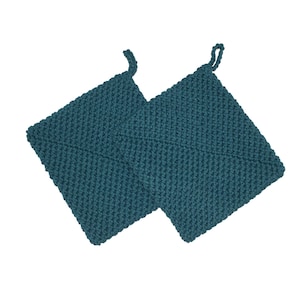 May include: Two teal-colored, square potholders with a knitted texture. Each potholder has a loop at the corner for hanging. The potholders are made of a thick, durable material, suitable for kitchen use.