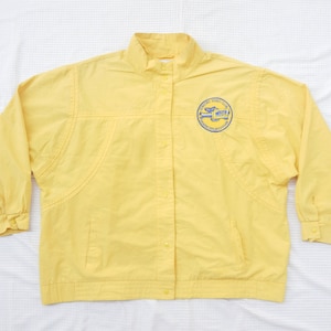 May include: A yellow jacket with a blue and white logo that says "Ferry Vac. Co. - Washington, Missouri".