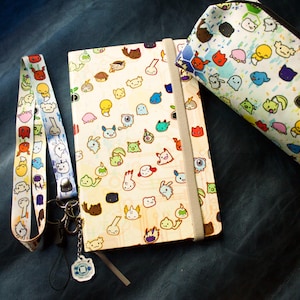 Set Baby Digimon con quaderno A5, astuccio e cordino