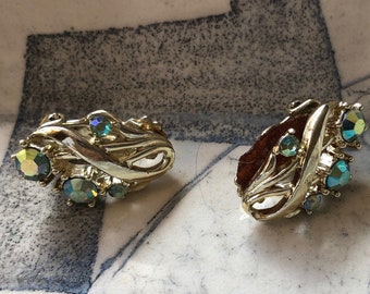 STAR signed mid century floral spray clip back earring in gold with green aurora borealis stones