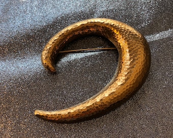 Dramatic Monet hammered gold half moon brooch pin