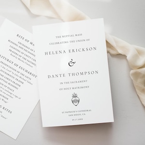 May include: White wedding ceremony programs and invitation cards with black text. The invitation card reads "Helena Erickson & Dante Thompson" and includes the date and location. A cream-colored ribbon is draped across the items.