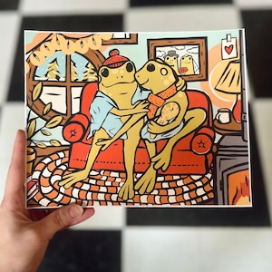 Cozy Winter Frog Family and tadpole print - 8x10” or 5x7&quot; everyday life wall print with frog couple and baby by the fire in warm home