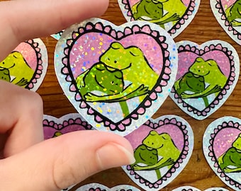 Hugging Frogs Sticker - holographic 2" vinyl laptop sticker cute frog and toad in love in scalloped pink heart