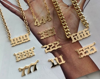 May include: Gold chain necklaces with different number pendants. The numbers include 999, 444, 333, 222, 666, 555, 111, and 77.