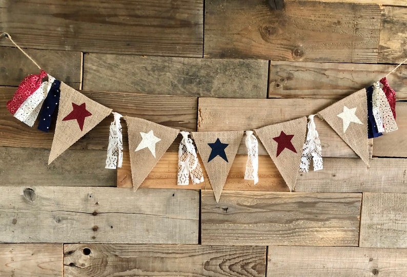 4th of July patriotic burlap banner handmade with lace and stars. Come be inspired by 4th of July Tablescapes, Patriotic Decor & USA Finds: Happy Birthday, America in case you're in the mood for American flag and red, white, and blue festive finds.