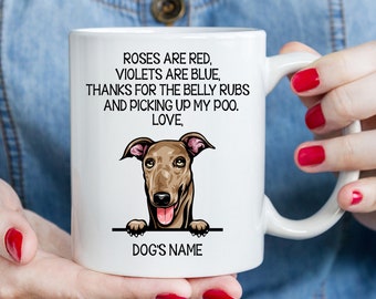 May include: White ceramic coffee mug with a brown dog peeking over the top. The mug has the text "Roses are red, violets are blue, thanks for the belly rubs and picking up my poo. Love, Dog's Name" printed on it.