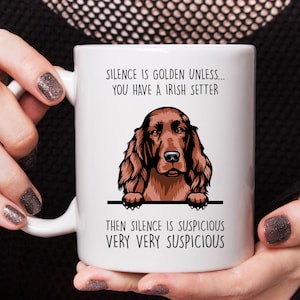 May include: White ceramic mug with a brown Irish Setter dog peeking over the rim. The mug reads "Silence is golden unless... you have an Irish Setter. Then silence is suspicious very very suspicious."