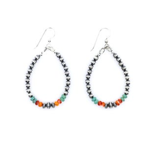 May include: Silver hoop earrings with turquoise and orange beads. The earrings are oval shaped and have a silver hook closure.