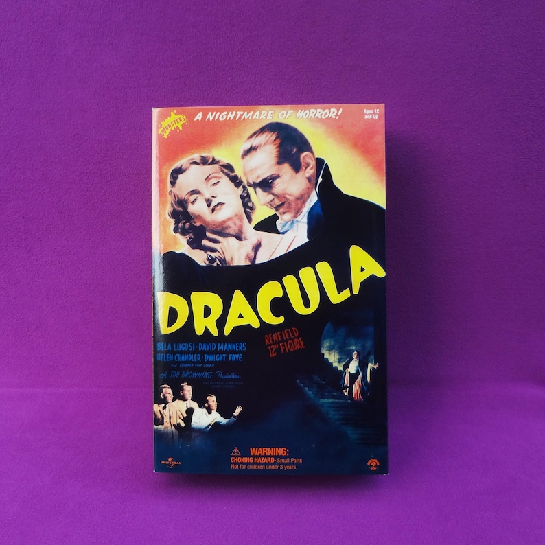 May include: A vintage Dracula movie poster-style box featuring Bela Lugosi. The box art includes the movie title in yellow, cast names, and the phrase "A Nightmare of Horror!". The figure is labeled as a 12" figure.