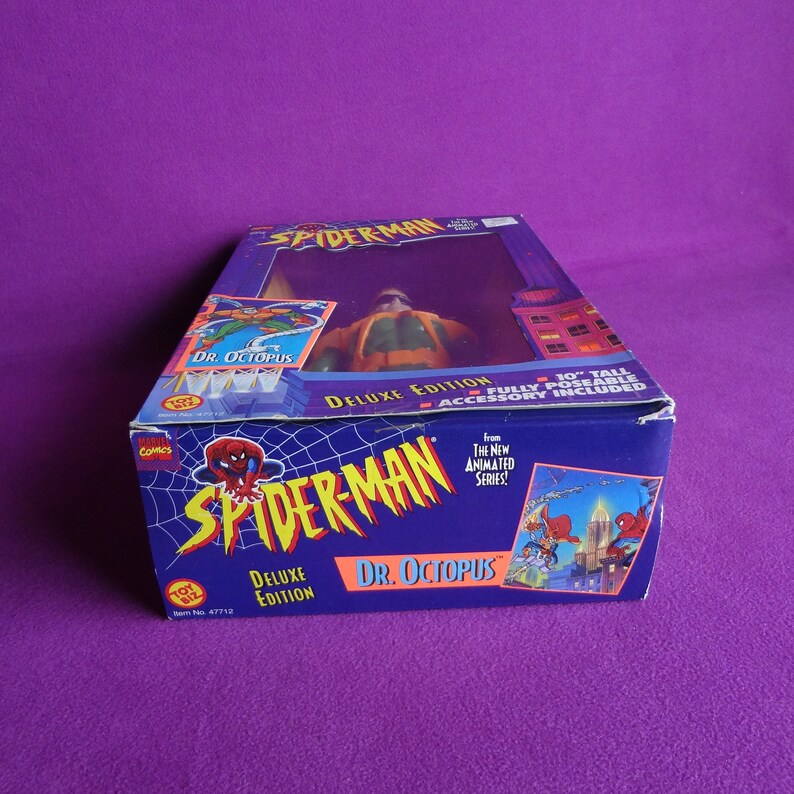 May include: A blue and red box with a Spider-Man figure of Dr. Octopus. The box features the text "Spider-Man Deluxe Edition Dr. Octopus" and "From The New Animated Series!" The figure is 10 inches tall and fully poseable.