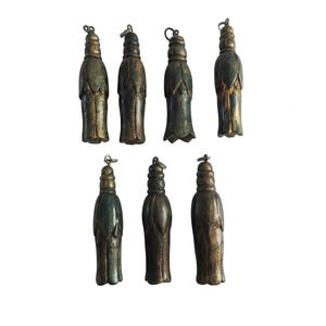 May include: A collection of seven dark, weathered, metallic-toned pendants shaped like elongated, stylized flower buds or tassels. Each piece features a tiered, rounded top with a small metal loop for attachment and a textured, aged finish.