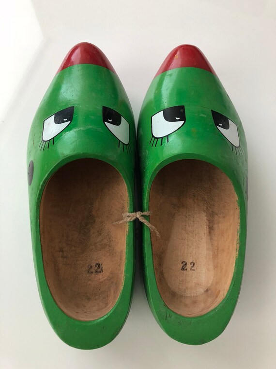 green wooden clogs