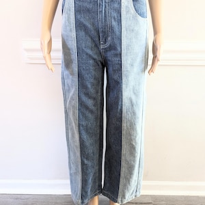 May include: Wide-leg jeans with a patchwork design featuring three different shades of blue denim.