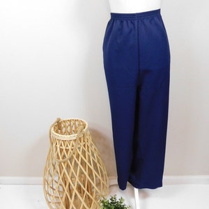 May include: A pair of navy blue high-waisted pants with a wide leg.