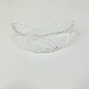 May include: Clear plastic safety glasses with a curved frame.