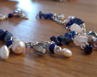 Silver bracelet with precious stones, freshwater pearls and christal.