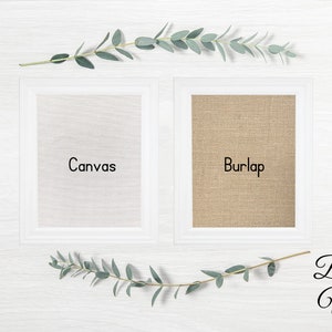 May include: Two white frames with beveled edges, one with a white canvas insert and the other with a burlap insert. The text "Canvas" is printed on the canvas insert and the text "Burlap" is printed on the burlap insert. The text "Beveled White" is printed below the frames.