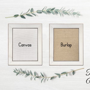 May include: Two white framed canvases, one with a white canvas insert and the text "Canvas" and the other with a burlap insert and the text "Burlap". The frames are on a white wood background with green eucalyptus sprigs.