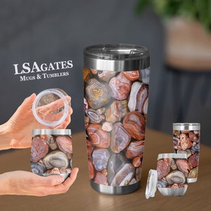 May include: A set of three stainless steel tumblers with a colorful agate pattern. The tumblers are available in different sizes, including a wine tumbler, a standard tumbler, and a travel mug. The tumblers are perfect for keeping drinks cold or hot for hours.