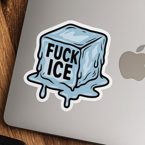 May include: A sticker featuring a cartoon ice cube with the words "FUCK ICE" in bold black letters. The ice cube is light blue with melting edges, and the sticker has a white border.