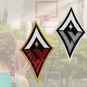 May include: Two diamond-shaped patches. One has a black background with a red and white "V" design, a gold border, and a small star. The other patch has a silver and white "V" design on a black background with a white border and a small star.