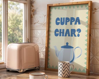 May include: A pink toaster with chrome accents sits next to a framed poster that reads "Cuppa Char?" with a teapot illustration. A white teacup and a patterned mug are on a wooden surface near a window.