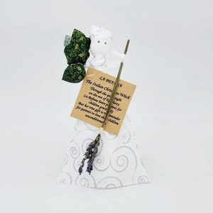 La Befana in white dress with silver swirls, lavender broom and dark green satchel with gold holly. Handmade in USA. OOAK