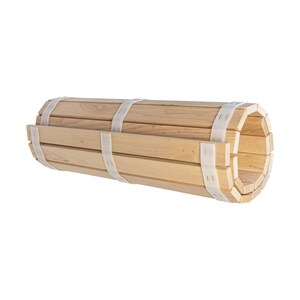 May include: A rolled up wooden mat with white straps. The mat is made of natural wood and is perfect for use as a yoga mat or meditation mat.