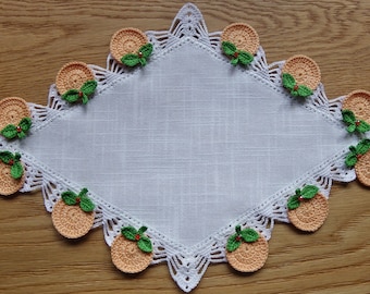 Doilies with crochet border and application of miniature fruit and beads