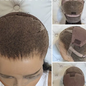 May include: A brown lace wig with adjustable straps and clips. The wig is shown on a mannequin head with a white background.
