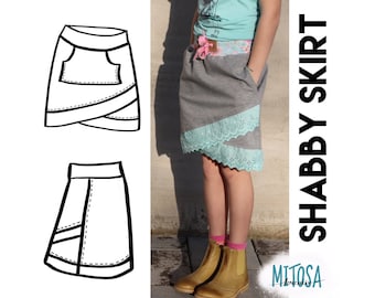 May include: A black and white line drawing of a skirt with a pocket and a layered design. A girl is wearing a gray skirt with a blue lace trim and a pink ribbon. The text "Shabby Skirt" is written vertically in black on a white background. The text "Mitosa Kreativ" is written in black on a white background.