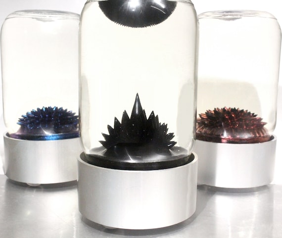 Magnetic ferrofluid in a sealed display bottle that forms mesmerizing living spikes when you wave a magnet near it — basically a tiny alien life-form on your desk.