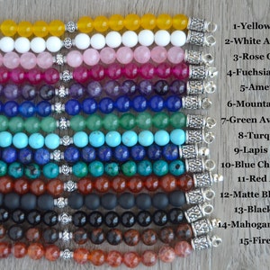 May include: Fifteen different gemstone bracelets with silver clasps. The bracelets are arranged vertically, with the yellow agate bracelet at the top and the fire agate bracelet at the bottom. The bracelets are labeled with their corresponding gemstone names.