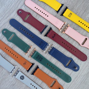 May include: Assortment of colorful leather watch bands with personalized text, including "DTW", "SLK", "KMZ", "YOUR LOGO HERE", "ZVA", and "SGB".