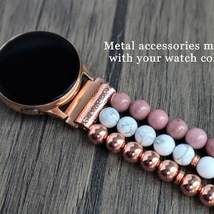 May include: A rose gold smartwatch band with a black watch face and a multi-strand beaded bracelet. The bracelet features pink, white, and rose gold beads. "Metal accessories match with your watch color." is written in the image.